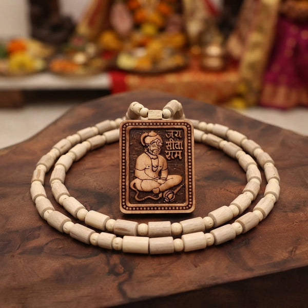 Close up of synthetic plastic prayer beads held in hands, highlighting their artificial texture in a dimly lit, spiritual set